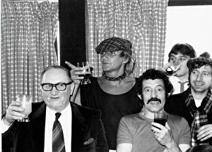 00054 Gallery: Scotlands Rock superstar Rod Stewart celebrates with a drink after the England v