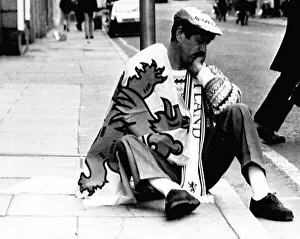 Scots football fan Italia 1990 World Cup dejected Scotland fan sits on pavement