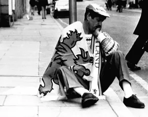 Scots football fan Italia 1990 World Cup dejected Scotland fan sits on pavement Scots football fan Italia 1990 World Cup dejected Scotland fan sits on pavement
