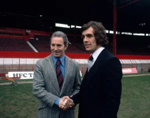 Scottish forward Joe Jordan shakes hands with manager Dave Sexton after signing for new Scottish forward Joe Jordan shakes hands with manager Dave Sexton after signing for new