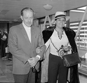 Images Dated 29th September 1973: Scottish thriller writer Alistair MacLean with his wife Mary Marcelle Maclean leave
