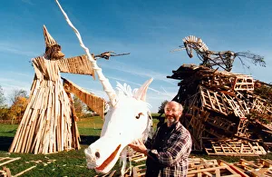 Sculptor, Phil Bews with his bonfire sculptures of a wizard and a unicorn Sculptor, Phil Bews with his bonfire sculptures of a wizard and a unicorn