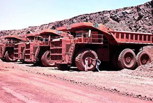 Series of large haul packs iron ore mine at Mount Newman in Western Australia Series of large haul packs iron ore mine at Mount Newman in Western Australia