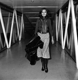 Images Dated 8th February 1975: Shakira, wife of actor Michael Caine leaves Heathrow Airport today to join husband in