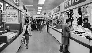 Images Dated 10th July 1985: Shoppers browsing in Manchesters High Street Market. 10th July 1985