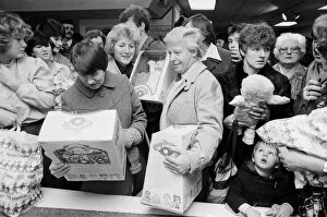 Images Dated 3rd December 1983: Shoppers buying Cabbage Patch Dolls at Hamleys, London toy store. 3rd December 1983