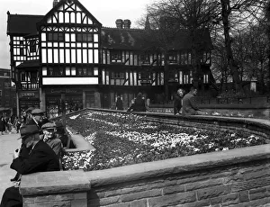 Shoppers enjoy the spring sunshine and the flower beds outside Timothy Whites in Trinity Shoppers enjoy the spring sunshine and the flower beds outside Timothy Whites in Trinity