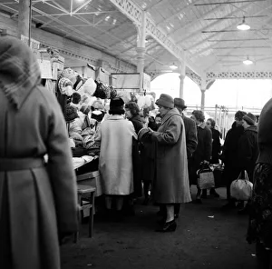 Shoppers looking at hats at Doncaster market, South Yorkshire. 5th April 1962 Shoppers looking at hats at Doncaster market, South Yorkshire. 5th April 1962