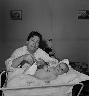 Sid Field with baby. September 1948 O14844-001 Sid Field with baby. September 1948 O14844-001