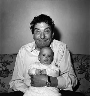 Sid Field with baby. September 1948 O14844 Sid Field with baby. September 1948 O14844