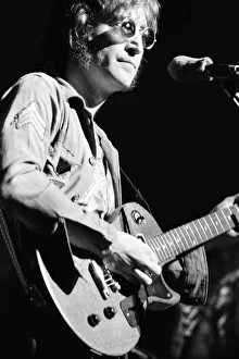 Images Dated 30th August 1972: Former singer of The Beatles pop group John Lennon pictured performing on stage during