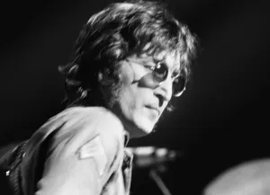 Images Dated 30th August 1972: Former singer of The Beatles pop group John Lennon pictured performing on stage during