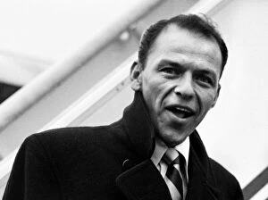 Images Dated 17th October 2014: Singer Frank Sinatra about to board a TWA flight to New York at London Airport