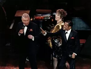 Singer Frank Sinatra on stage with Liza Minnelli and Sammy Davis Jnr performing on stage