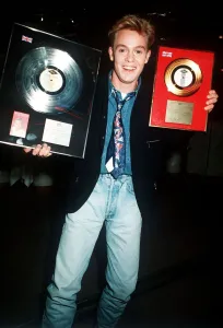 Singer Jason Donovan receives his Platinum and Gold Disc Awards at a party in London Singer Jason Donovan receives his Platinum and Gold Disc Awards at a party in London