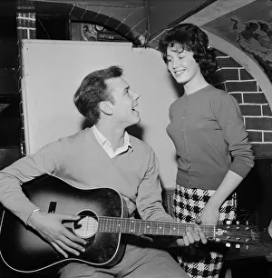 Singer Marty Wilde sings to his fiancee Joyce Baker (18), 28th October 1959 Singer Marty Wilde sings to his fiancee Joyce Baker (18), 28th October 1959