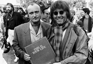 Singer Phil Collins is surprised by This Is Your Life presenter Michael Aspell Singer Phil Collins is surprised by This Is Your Life presenter Michael Aspell