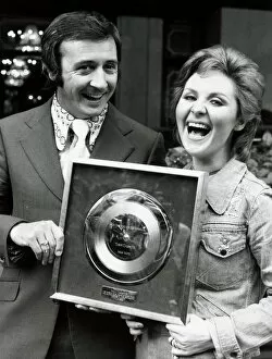 Images Dated 14th August 1972: Singer Tony Christie with pop singer Lulu wins award for a million sales of his hit Is