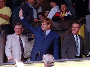 Singer and Watford Chairman Elton John acknowledge the standing ovation from the fans as Singer and Watford Chairman Elton John acknowledge the standing ovation from the fans as