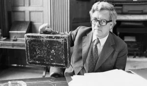 01429 Gallery: Sir Geoffrey Howe holding up budget box in his office at the Treasury - June 1979