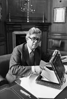 01429 Gallery: Sir Geoffrey Howe putting speech into budget box in his office at the Treasury - June