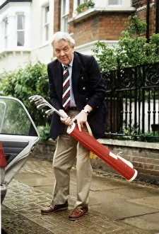 Images Dated 24th June 1994: Sir Nicholas Scott MP holding golf clubs