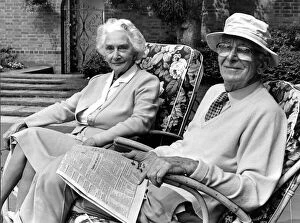 Images Dated 26th July 1984: Sir William Lyons and Lady Lyons pictured in their garden at Wappenbury Hall