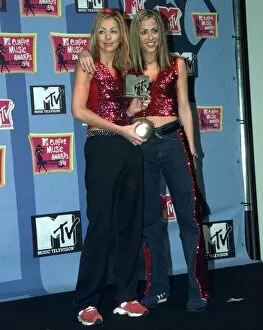 Images Dated 12th November 1998: Sisters Natalie Appleton and Nicole Appleton of pop group All Saints pick up their award