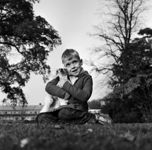 Six-year-old Richard Brown with his miniature white Poodle Dewdrop Six-year-old Richard Brown with his miniature white Poodle Dewdrop
