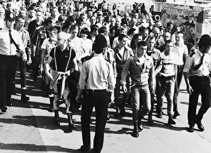 Images Dated 31st August 1982: Skinheads being marched back to the railway station at Southend Essex where a strong