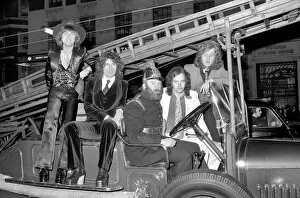 Images Dated 13th February 1975: The Slade pop group on fire engine. L to R Dave Hill, Don Powell, Jimmy Lea, Noddy Holder