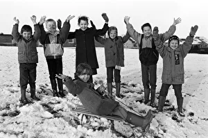 Sledging at School, Tracey Douglas is cheered on by schoolmates at Carr Green Junior Sledging at School, Tracey Douglas is cheered on by schoolmates at Carr Green Junior