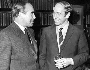A smiling Bobby Charlton talking to England team manager Sir Alf Ramsey (left A smiling Bobby Charlton talking to England team manager Sir Alf Ramsey (left