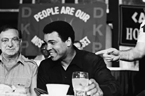 A smiling Muhammad Ali at pre fight press conference for his upcoming fight with Larry A smiling Muhammad Ali at pre fight press conference for his upcoming fight with Larry