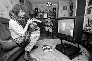 Images Dated 13th February 1990: When snake lover Tony Griffiths settles down to watch TV with Monty, his pet python