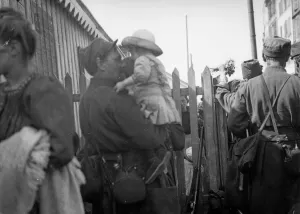 A soldier of the French 6th Army says goodbye to his daughter at Le Harve before moving A soldier of the French 6th Army says goodbye to his daughter at Le Harve before moving