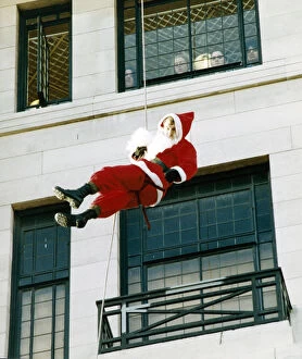 Images Dated 18th November 1992: Soldier John Greenfield, dressed as Father Christmas, was abseiling down the side of a