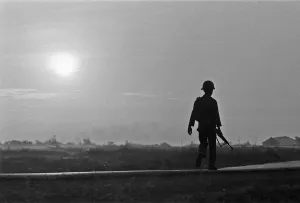 A soldier of the South Vietnamese army advances on Viet Cong positions in Trang Bang just A soldier of the South Vietnamese army advances on Viet Cong positions in Trang Bang just