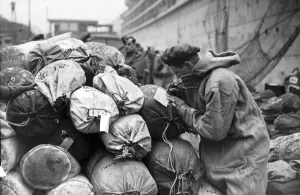 Soldier writes a farewell card home before embarking on a troopship bound for the Italian Soldier writes a farewell card home before embarking on a troopship bound for the Italian