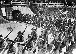 Soldiers of the Australian Imperial Force march into the parade ground in Malaya during Soldiers of the Australian Imperial Force march into the parade ground in Malaya during
