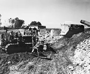 Soldiers digging with a digger during second World War. Circa 1940s Soldiers digging with a digger during second World War. Circa 1940s