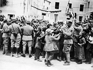 Soldiers of the French forces operating in Italy distributing French flags to Soldiers of the French forces operating in Italy distributing French flags to