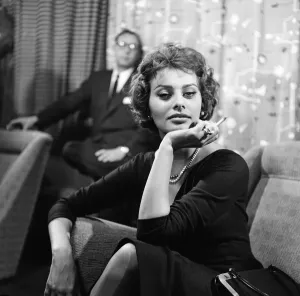 Sophia Loren pictured sitting in a chair at London Airport Sophia Loren pictured sitting in a chair at London Airport