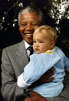 South Africa's President Nelson Mandela with a young white boy South Africa's President Nelson Mandela with a young white boy