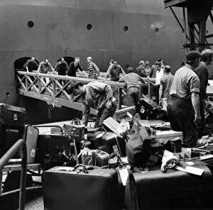 Southampton Docks: Shore and office staff of Cunard, loading baggage onto Q.E