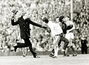 Spectator runs onto football pitch chased by policeman Arsenal v Tottenham Spectator runs onto football pitch chased by policeman Arsenal v Tottenham