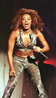 Images Dated 1st November 1997: Spice Girl Mel B performs for Prince Harry and his father Prince Charles in Johannesburg