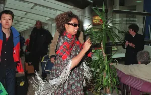 Spice Girls Mel B wearing a tartan scarf and sunglasses April 1998 Spice Girls Mel B wearing a tartan scarf and sunglasses April 1998