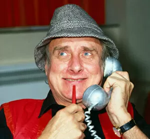 Spike Milligan comedian holding silver telephone April 1991