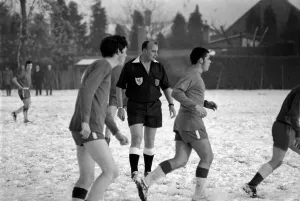 Sport Amateur football youth game in action in the snow near Maidshow between two local Sport Amateur football youth game in action in the snow near Maidshow between two local